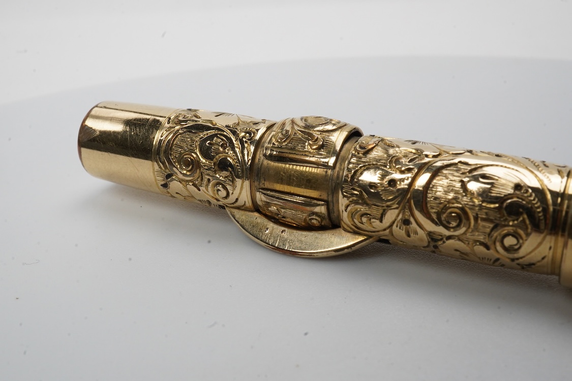 A Conklin ring top hand engraved crescent filler fountain pen with 14ct. gold Conklin nib